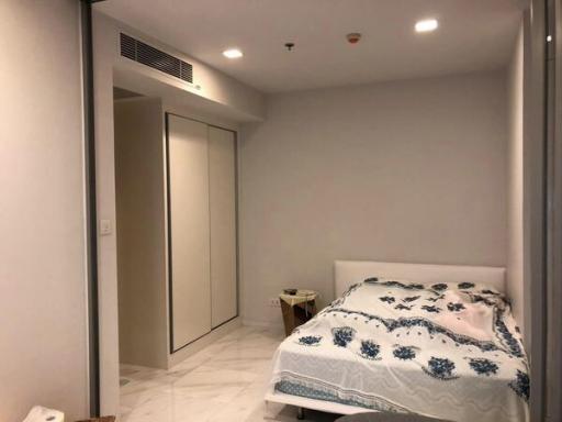 Cozy bedroom with modern design and built-in wardrobe