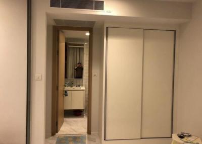 Bedroom with sliding closet doors and en-suite bathroom entrance