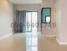 Spacious and well-lit empty room with large windows and glossy tiled flooring