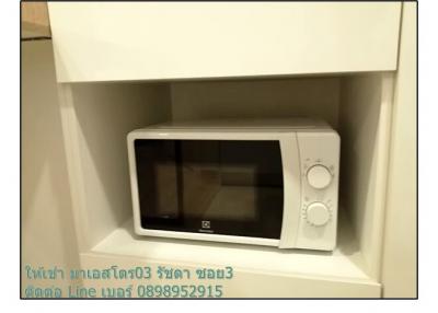 Compact white microwave in a kitchen nook