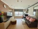 Spacious and well-lit living room with modern furnishings