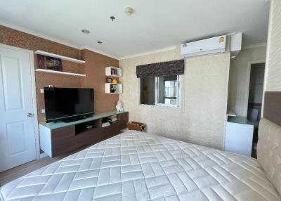Spacious Bedroom with Modern Amenities and Ample Lighting