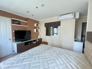 Spacious Bedroom with Modern Amenities and Ample Lighting