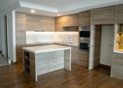 Modern kitchen with wooden cabinets and built-in appliances