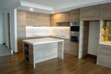 Modern kitchen with wooden cabinets and built-in appliances