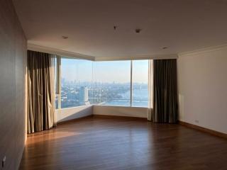 Spacious living room with large windows and city view