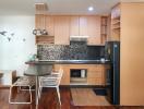 Modern kitchen with wooden cabinets and breakfast bar