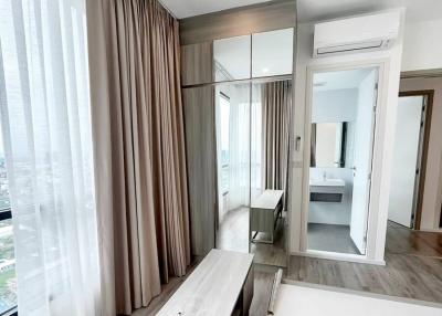 Modern bedroom with en-suite bathroom and city view