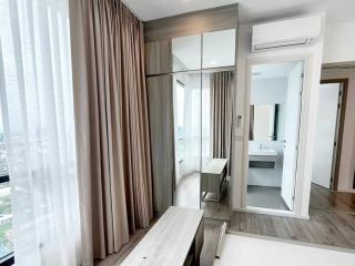 Modern bedroom with en-suite bathroom and city view