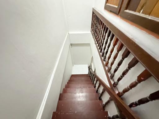 Wooden staircase with balustrade in a residential building