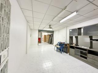 Spacious interior of a commercial building with a kitchenette