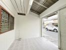 Spacious garage with white walls and tiled floor
