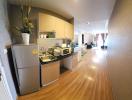 Modern kitchen with stainless steel appliances and open plan layout