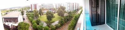 Panoramic view showcasing the surroundings of an apartment complex with green spaces