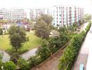 Panoramic view showcasing the surroundings of an apartment complex with green spaces