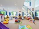 Spacious children's playroom with colorful toys and furniture