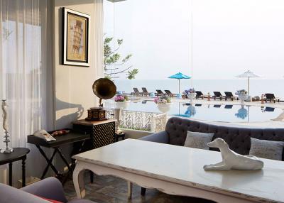 Sophisticated living room with panoramic ocean view and outdoor pool