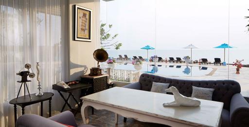 Sophisticated living room with panoramic ocean view and outdoor pool