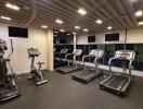 Well-equipped modern gym with treadmills and exercise bikes