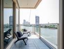 Modern balcony overlooking the river with outdoor seating