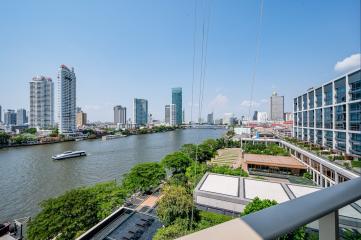 Spacious balcony with panoramic river view and city skyline