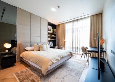 Modern bedroom with natural light and stylish furnishings