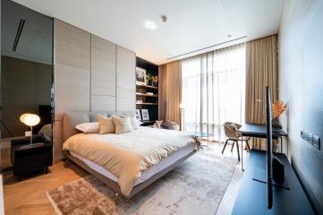 Modern bedroom with natural light and stylish furnishings