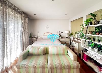 Bright and spacious bedroom with plants and natural light