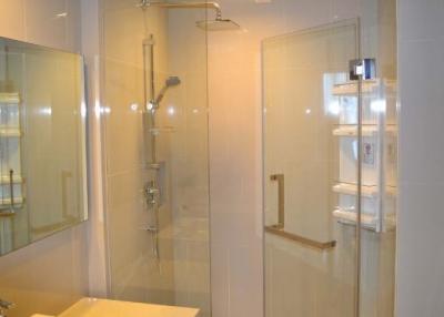 Modern bathroom interior with glass-walled shower