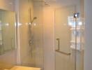 Modern bathroom interior with glass-walled shower