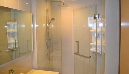 Modern bathroom interior with glass-walled shower