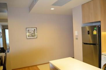 Modern kitchen interior with stainless steel refrigerator