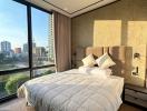 Modern bedroom with a large window and city view