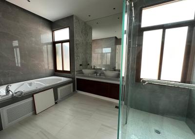 Spacious bathroom with modern amenities and ample natural light