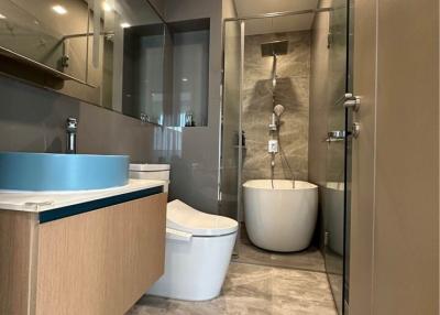 Modern bathroom with glass shower and contemporary fixtures