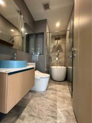 Modern bathroom with glass shower and contemporary fixtures