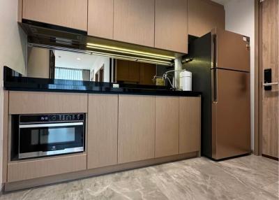 Modern kitchen with stainless steel appliances and wooden cabinets