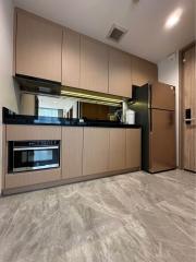 Modern kitchen with stainless steel appliances and wooden cabinets