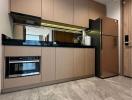 Modern kitchen with stainless steel appliances and wooden cabinets