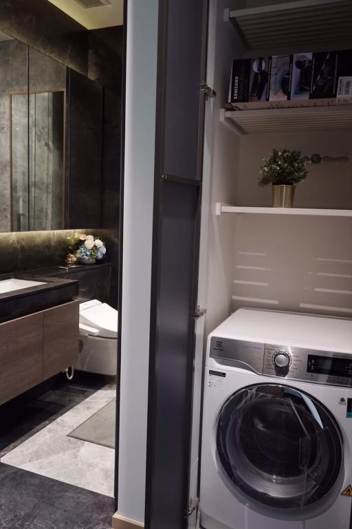 Modern bathroom with laundry appliances