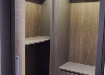 Modern built-in wooden closet with lighting
