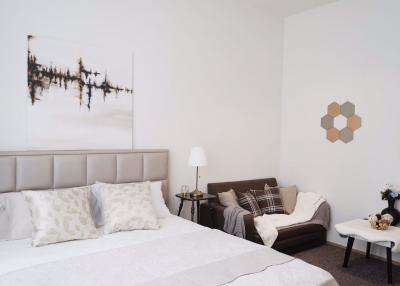 Modern bedroom with neutral color scheme and elegant decor