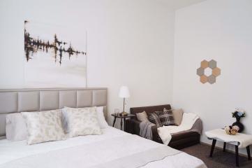 Modern bedroom with neutral color scheme and elegant decor