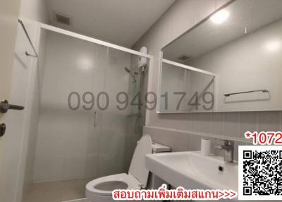 Modern bathroom interior with shower, toilet, and sink