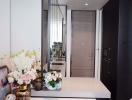 Modern corridor interior with decorative flowers and elegant reflective surfaces