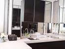 Modern kitchen with large mirrors and sleek design