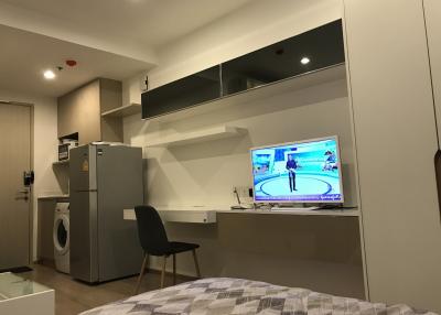 Compact bedroom with integrated appliances and entertainment system