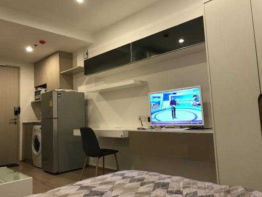 Compact bedroom with integrated appliances and entertainment system