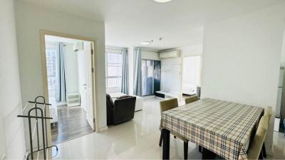 Spacious furnished studio apartment interior with combined living room and kitchen