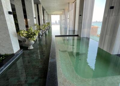 Luxury building indoor pool area with ocean view